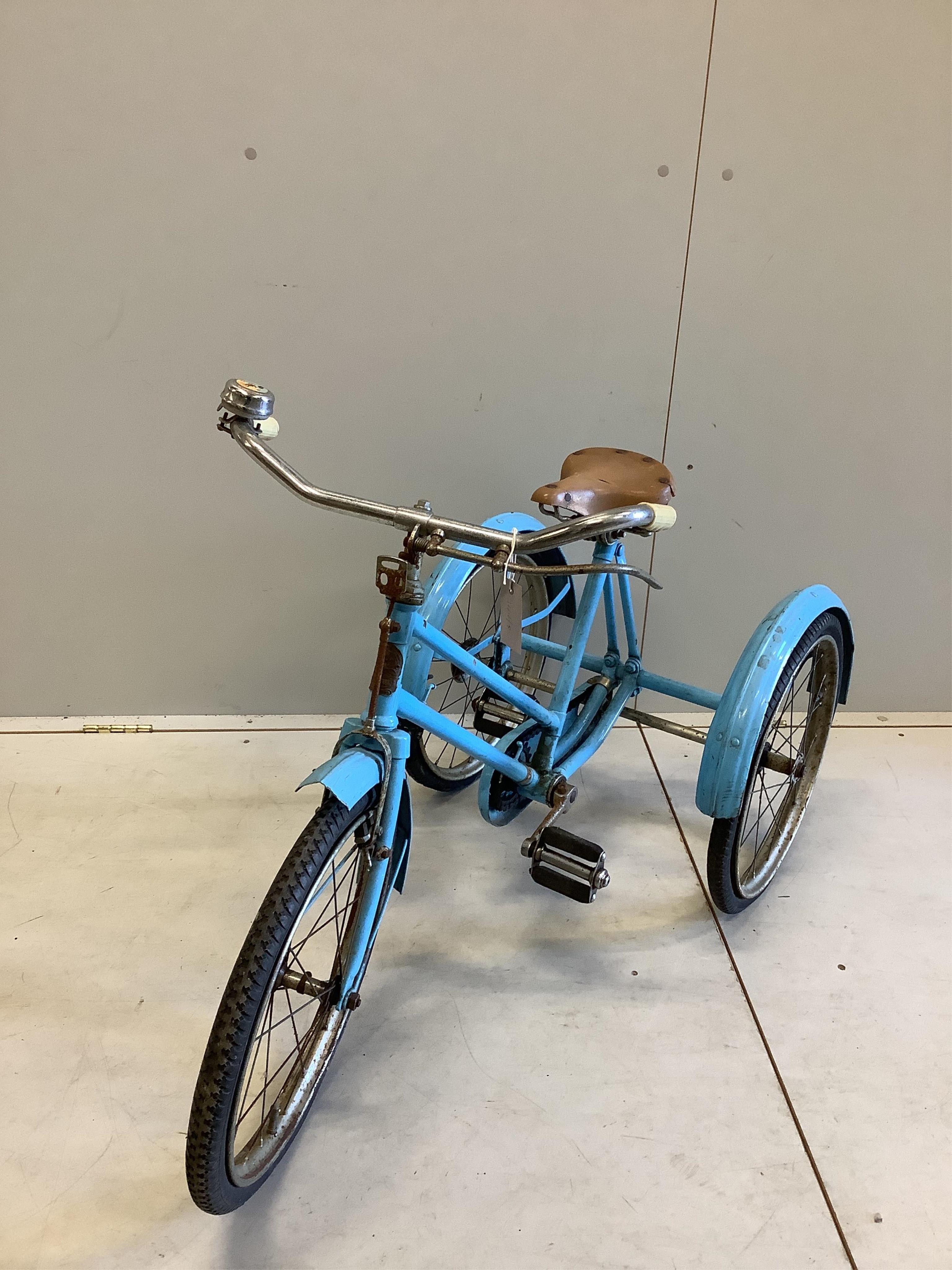 A vintage tricycle by Phillips Birmingham, length 110cm, height 73cm. Condition - fair